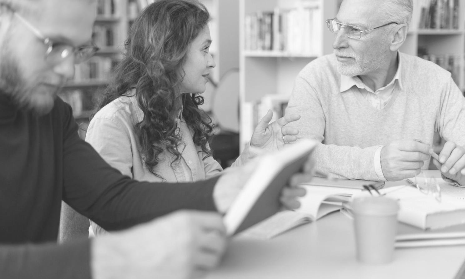 Students learning financial planning techniques in small group setting